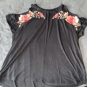 Black top with floral accents
